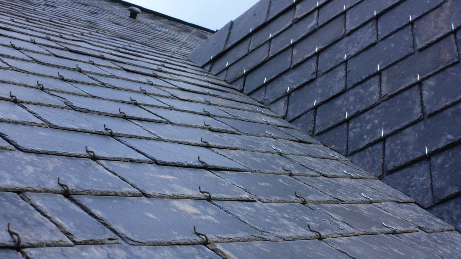 A new natural slate roof laid in even courses